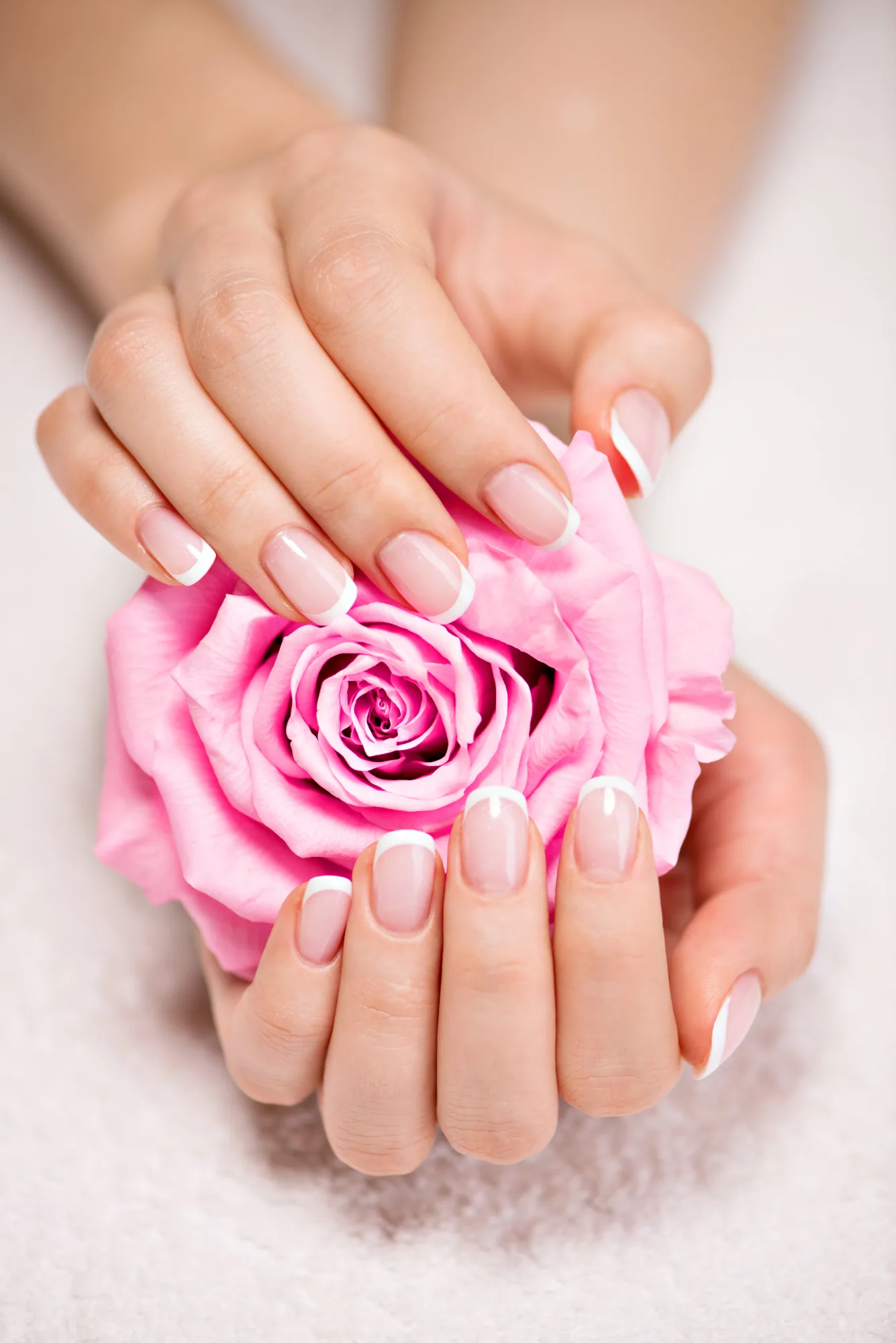 French manicure with a pink rose