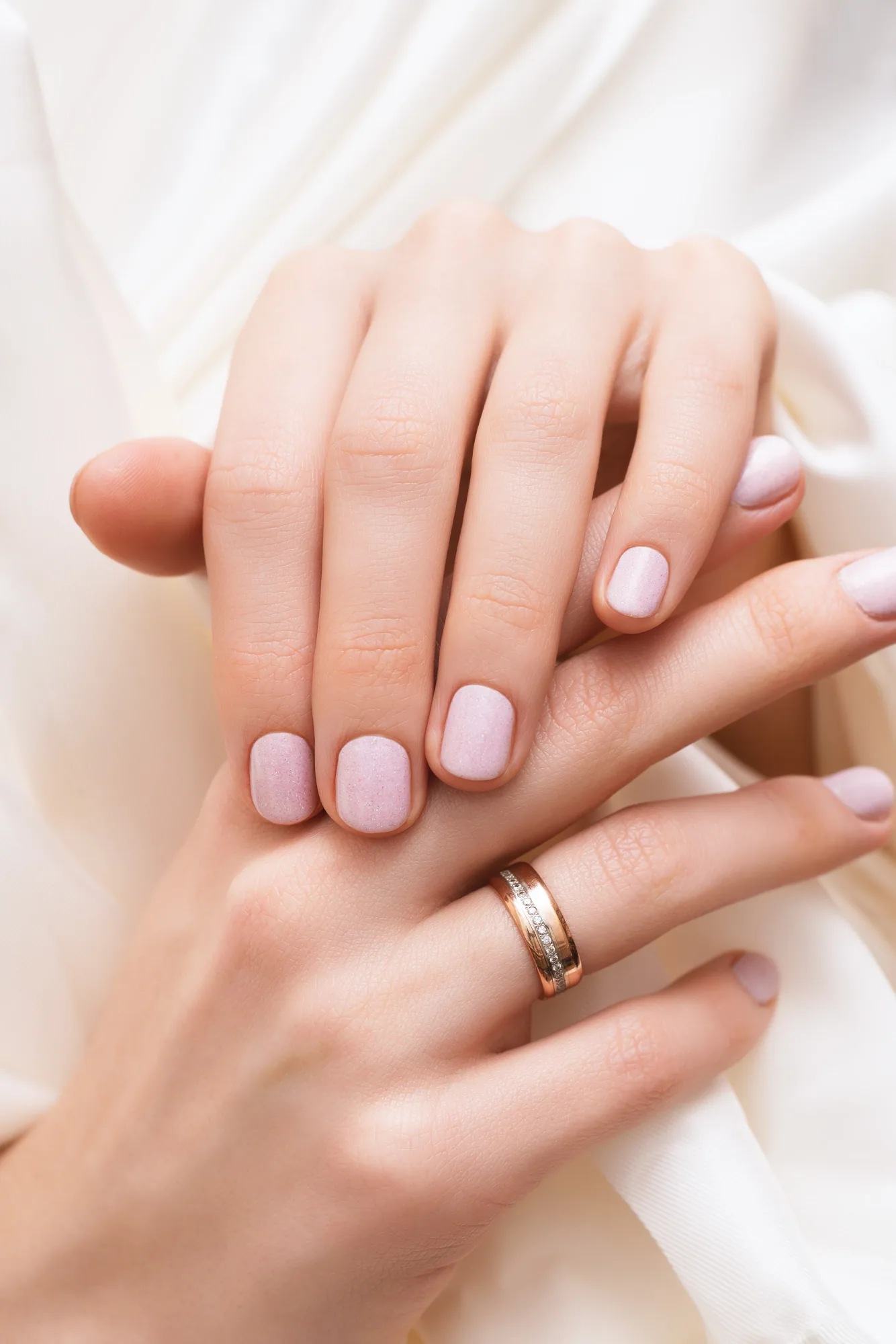 Soft pink glitter manicure